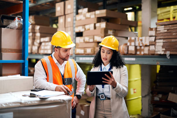 Warehouse, tablet and people teamwork for storage, inventory and supply chain management for b2b distribution. Factory, Industry partner or worker on digital technology, software and logistics boxes